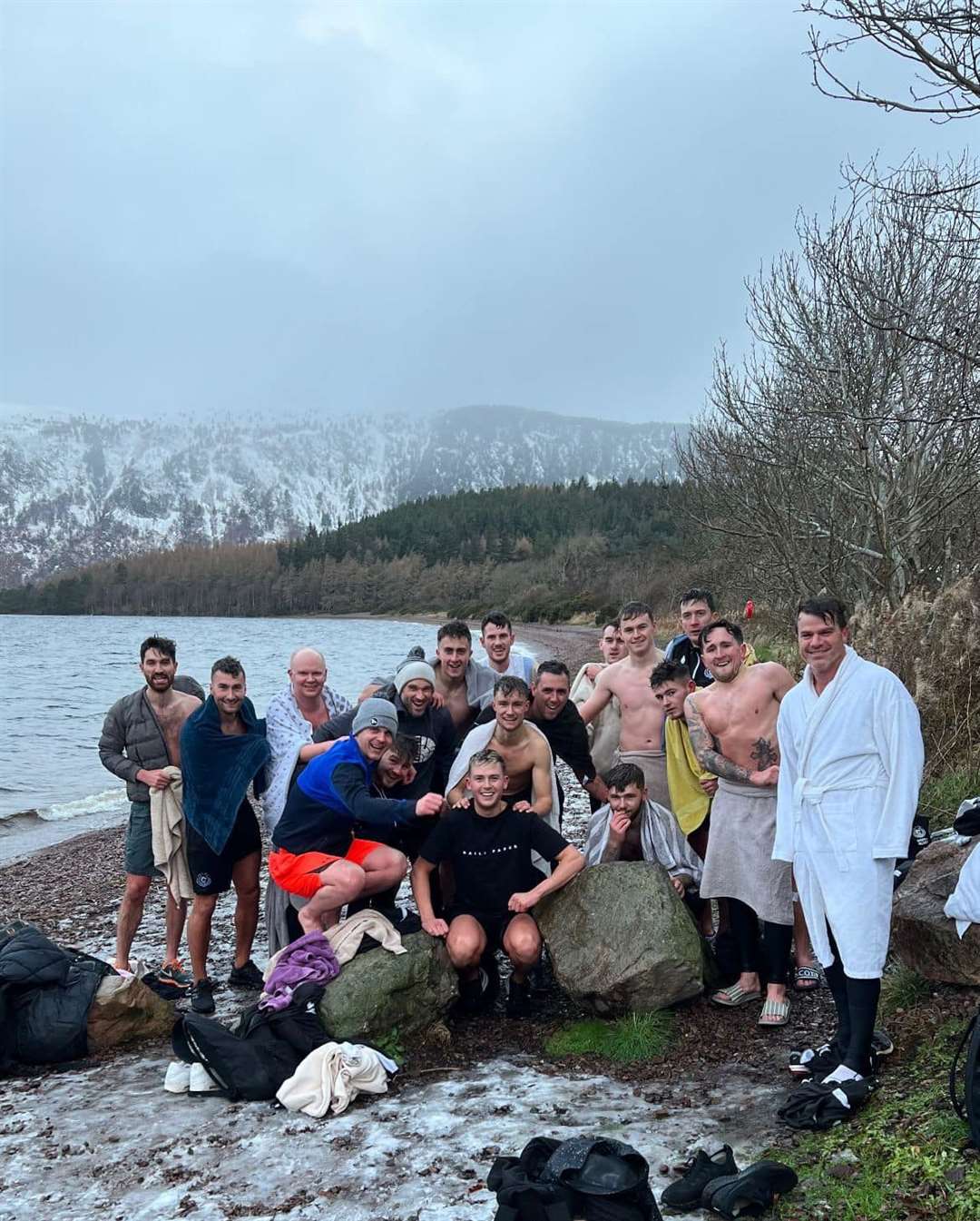 The players and staff “warmed up” for their Christmas Eve Players and Fans Dip with a dip in Loch Ness.