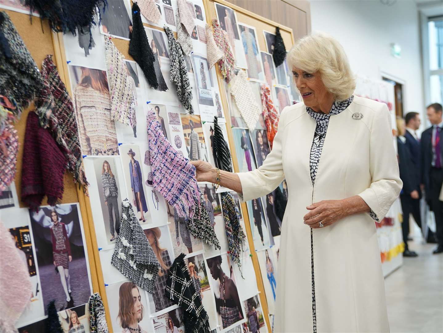 Camilla looked at samples of woven fabrics in the Maison Lesage tweed section of la Galerie du 19M (Yui Mok/PA)