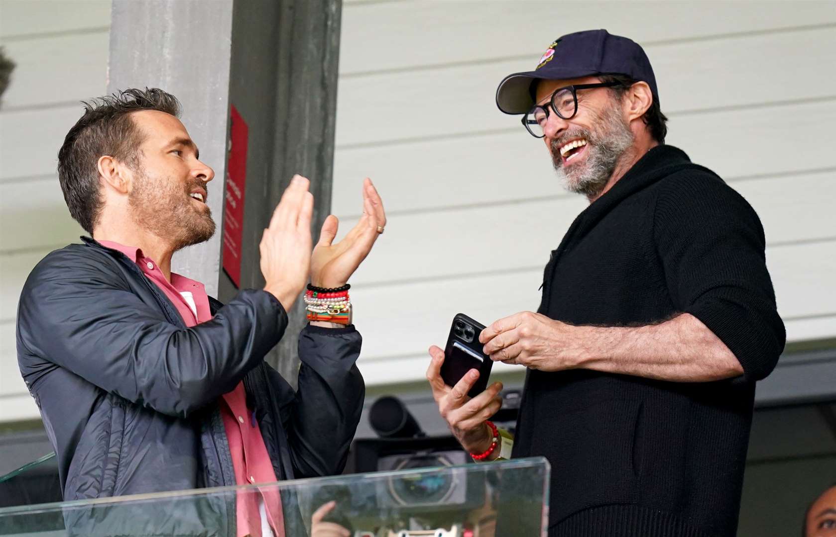 Ryan Reynolds (left) and Hugh Jackman in the stands watching Wrexham play (Jacob King/PA)