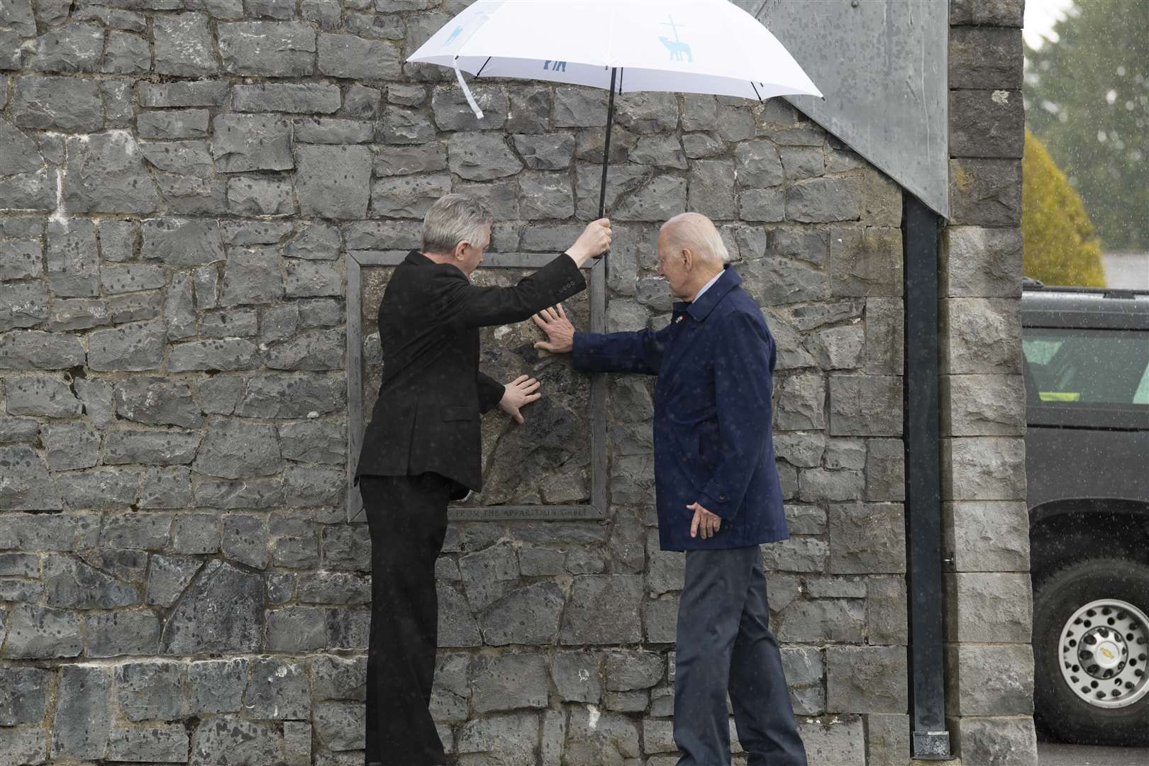Mr Biden touches the apparition wall at Knock Shrine and Basilica, on the last day of his visit (Andrew Downes/Julien Behal Photography/PA)