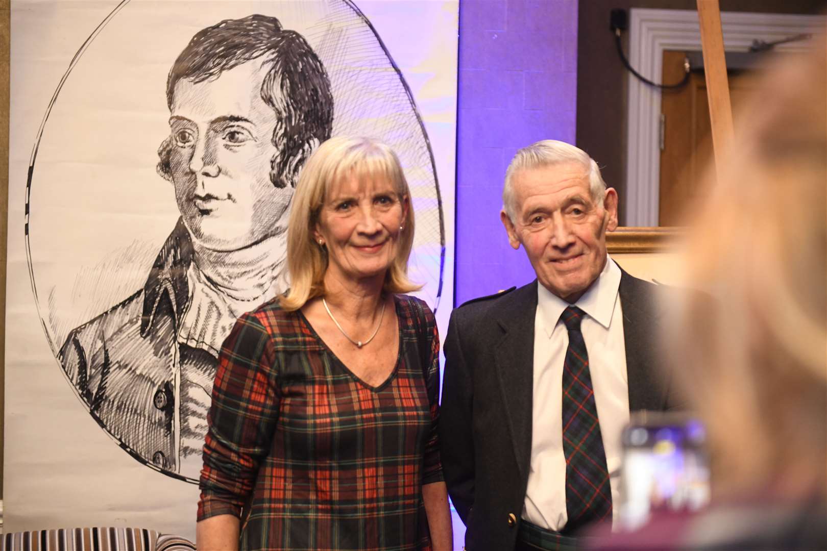Shirley Twigger and Ron Murray get a photo by the Robert Burns drawing. Picture: James Mackenzie.