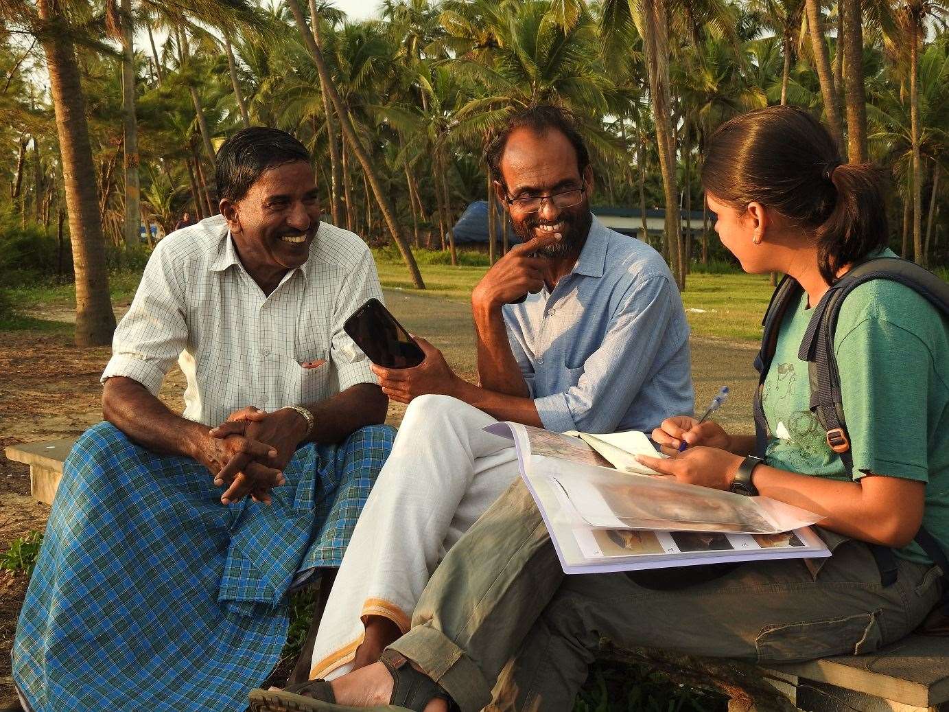 Ayushi Jai speaking to members of the local community in Kerala (Akshay V Anan/PA)