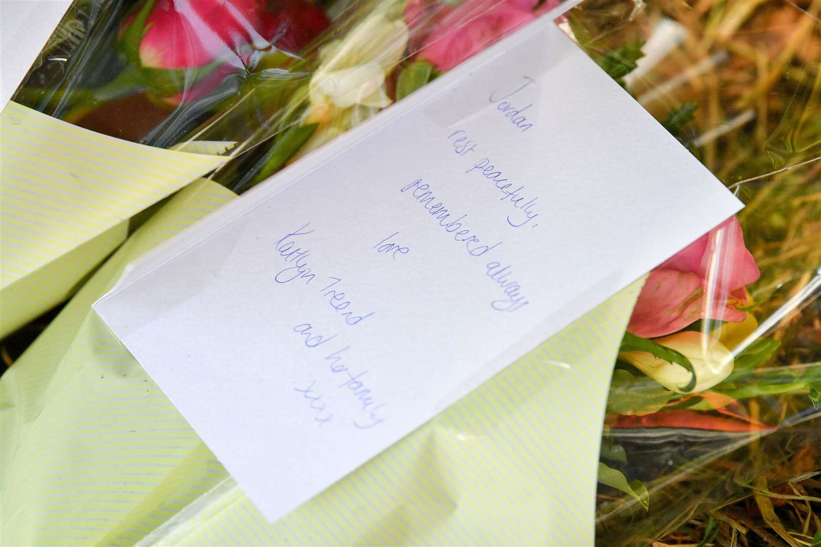 Floral tributes have been left at the scene of the crash (Ben Birchall/PA).