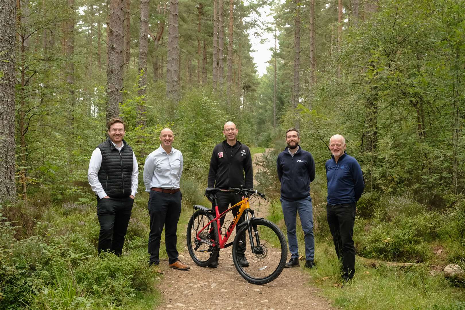 On the South Loch Ness Trail paths (from left) Michael Golding –Visit Inverness Loch Ness CEO; Chris Taylor of VisitScotland; Lindsay Mackinnon, owner of bike hire firm Ticket To Ride; Craig Cunningham, of SSE Renewables; and Graeme Ambrose, former Visit Inverness Loch Ness CEO.