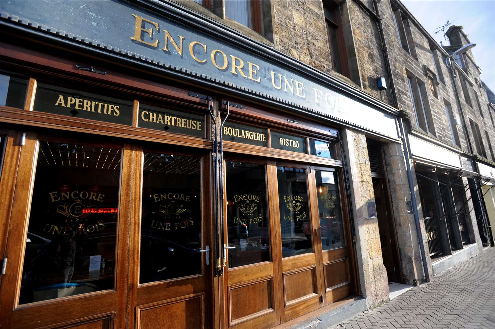 A barman was bitten on the chin at the Encore Une Fois bar restaurant.