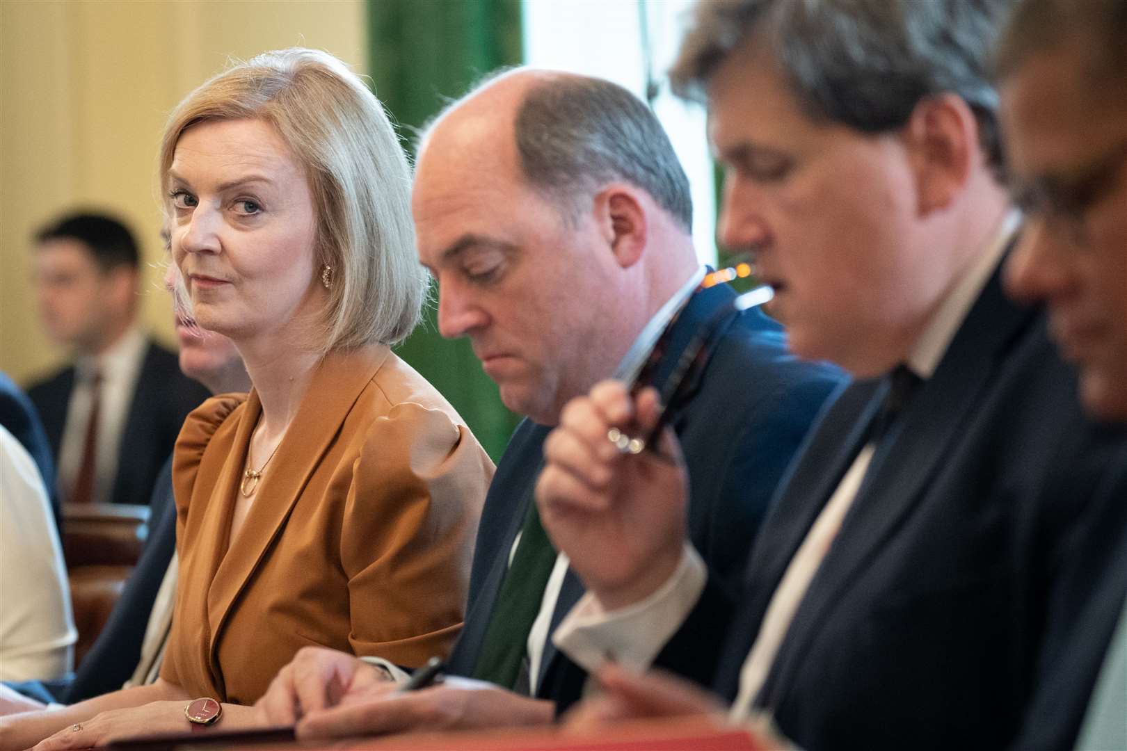 Foreign Secretary Liz Truss was sat opposite the Prime Minister she hopes to replace (Stefan Rousseau/PA)