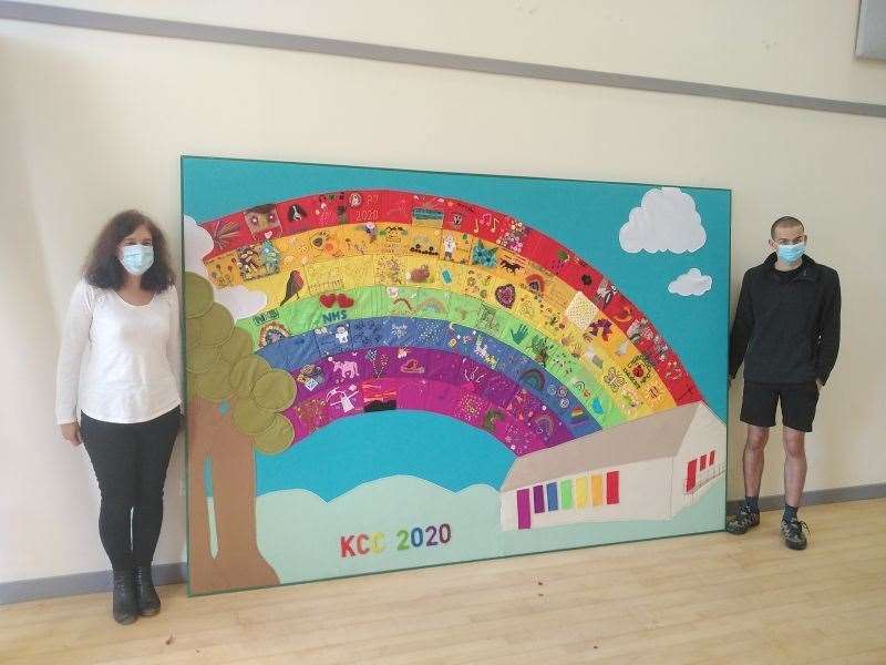 Angus with his mother Victoria display the Rainbow of Hope before it is fixed to the wall in Kirkhill Community Centre.
