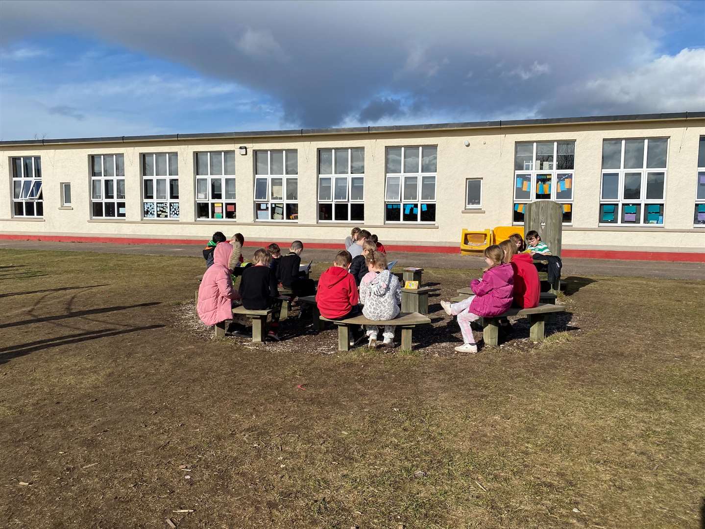 The whole school took part in reading outside.