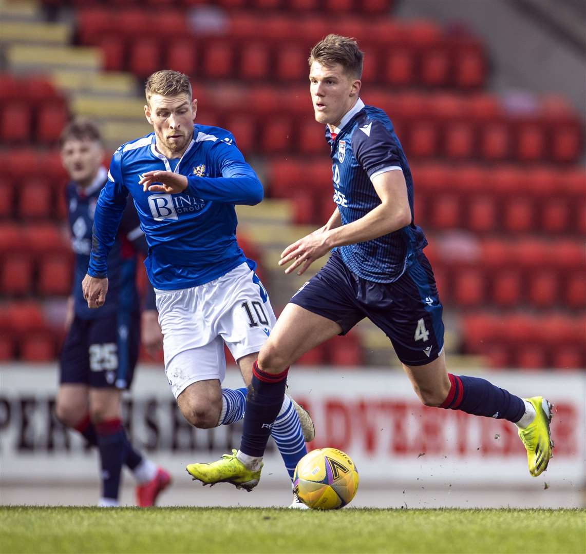 Ross County's Leo Hjelde gets past St.Johnstone's David Wotherspoon in 2021.