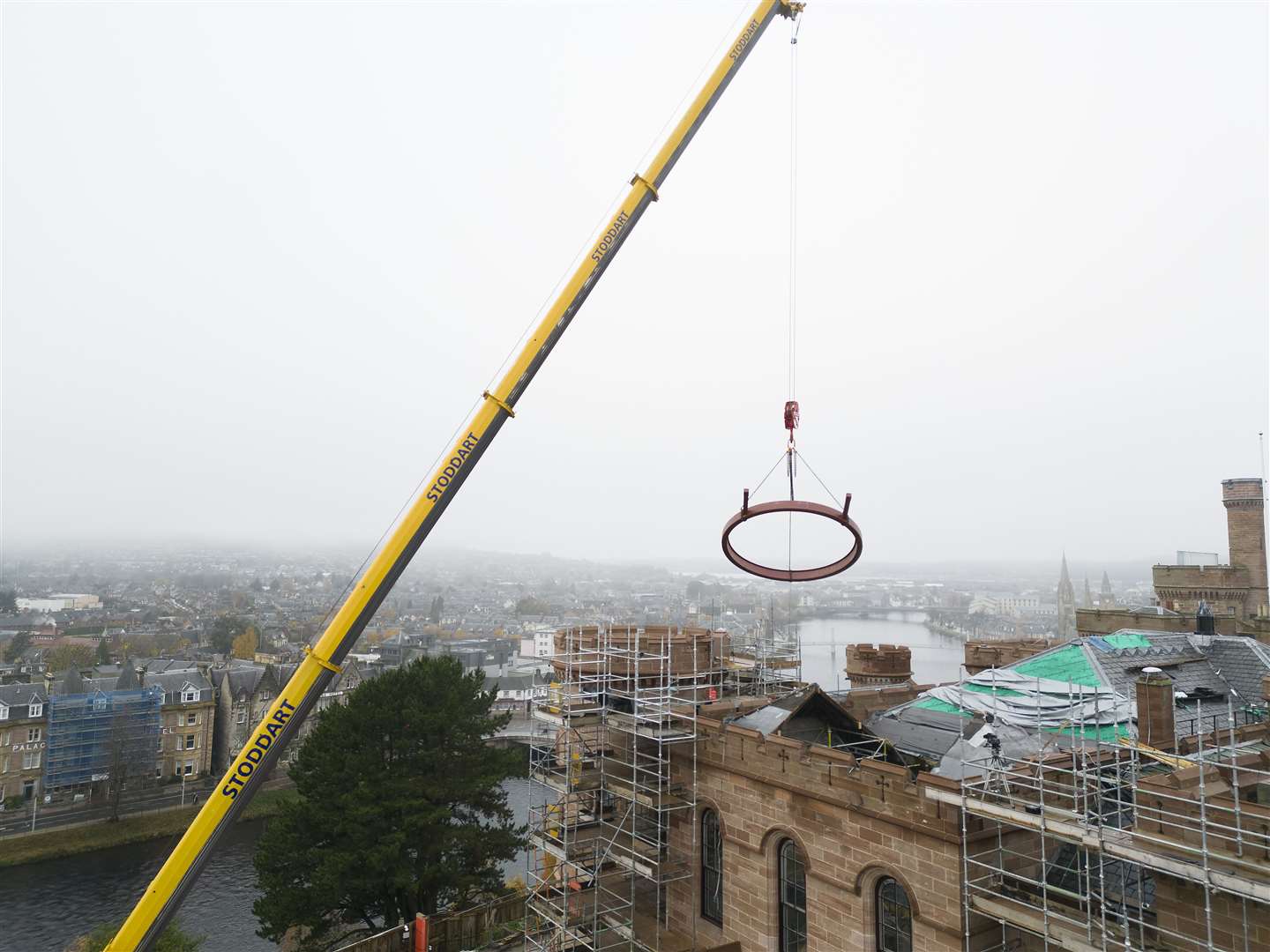 A crane lowers the circular steel frame which will hold the Rose Window. Picture: HLH/EwenWetherspoon.