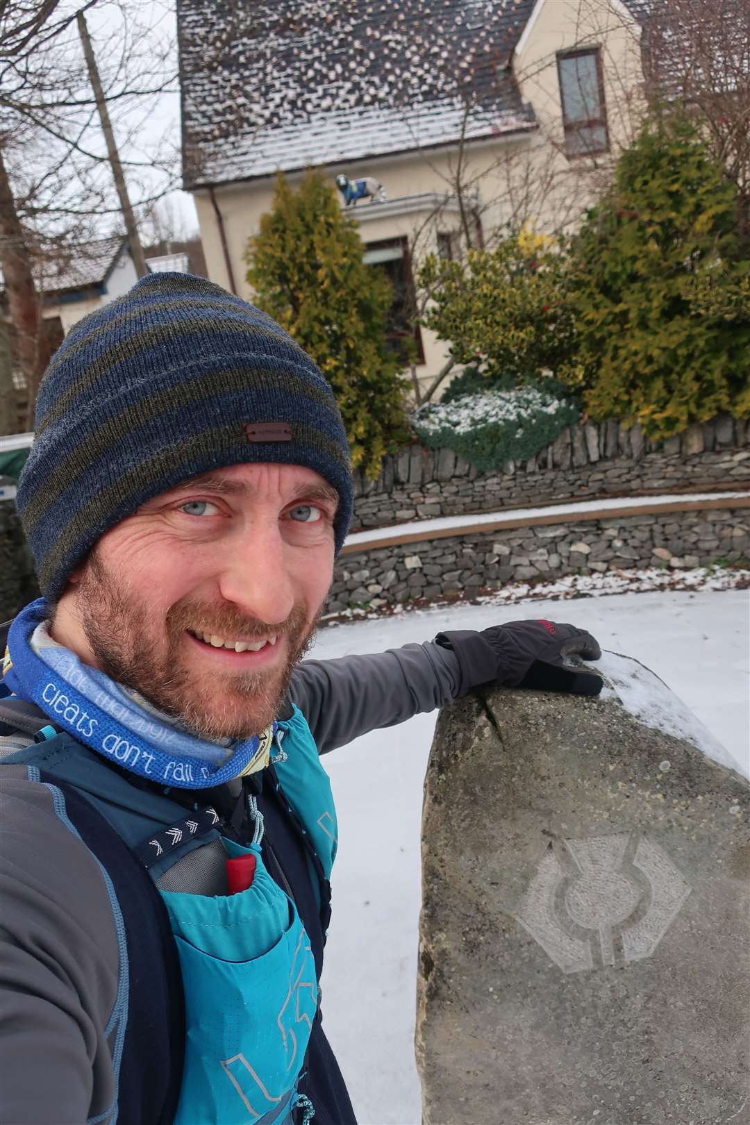 John at the end of his run – at the stone marking the terminus of the Speyside Way in Newtonmore.