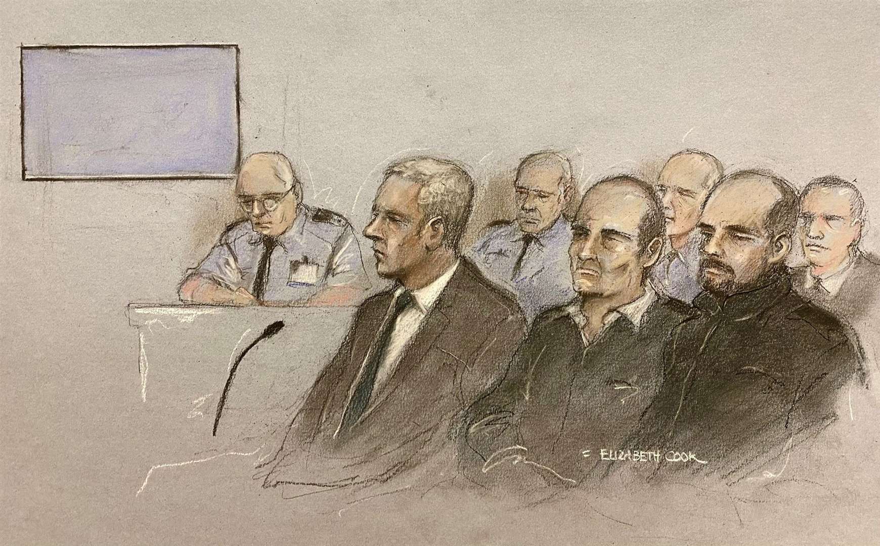 Court artist sketch of Jonathan Dowdall (front left), surrounded by dock officers and police during the trial at the Special Criminal Court in Dublin of Gerry ‘The Monk’ Hutch (Elizabeth Cook/PA)