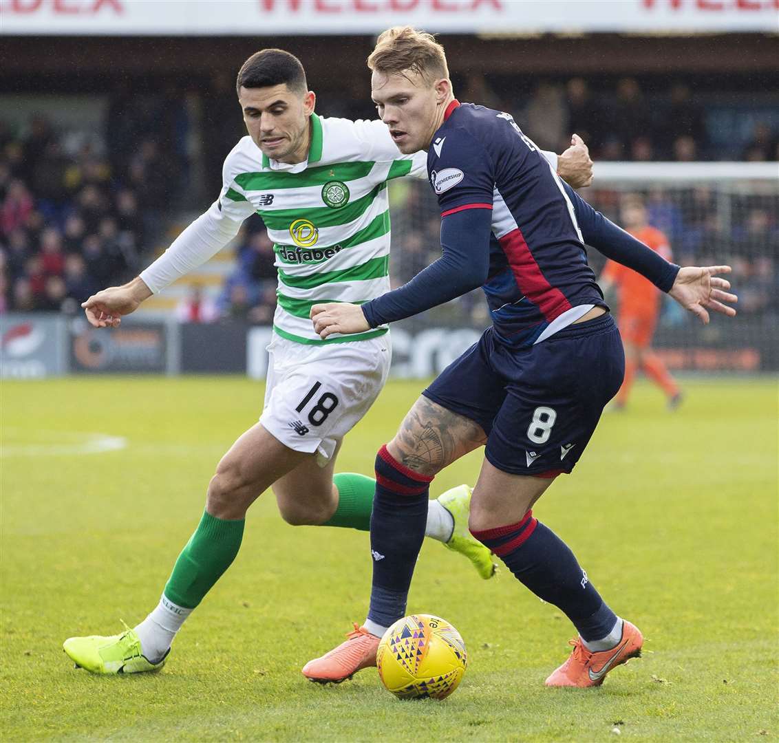 Ross County's Lee Erwin gets away from Celtic's Tom Rogic in December's clash