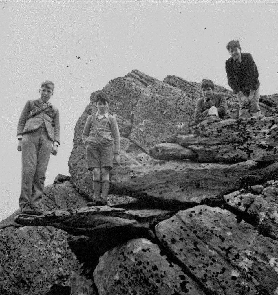Richard (left) and Kenneth Robertson (second left) with two other unknown boys on a climbing trip, complete with hemp ropes.