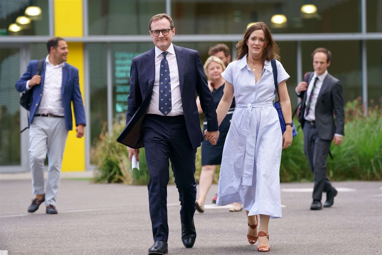 Tom Tugendhat arrives with his wife, Anissia, for the debate at Here East studios in east London (Victoria/PA)