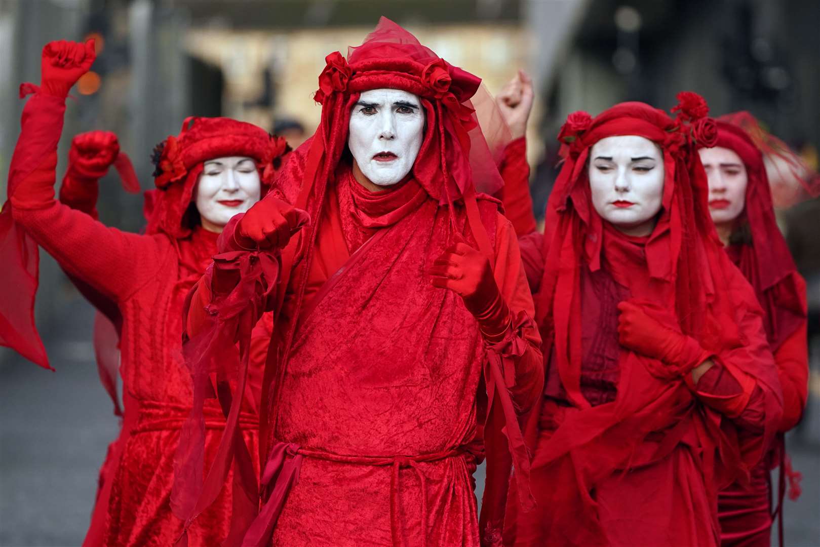 Extinction Rebellion Red Rebels during the official final day of the summit (Andrew Milligan/PA)