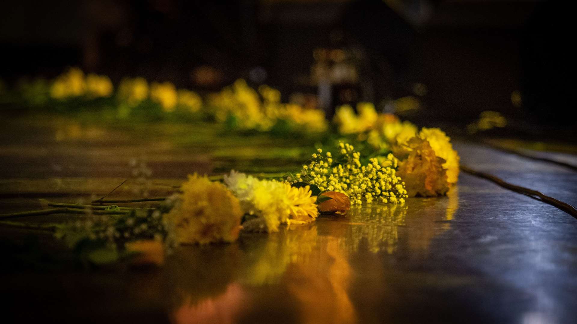 Flowers laid on the stage. Picture: Callum Mackay