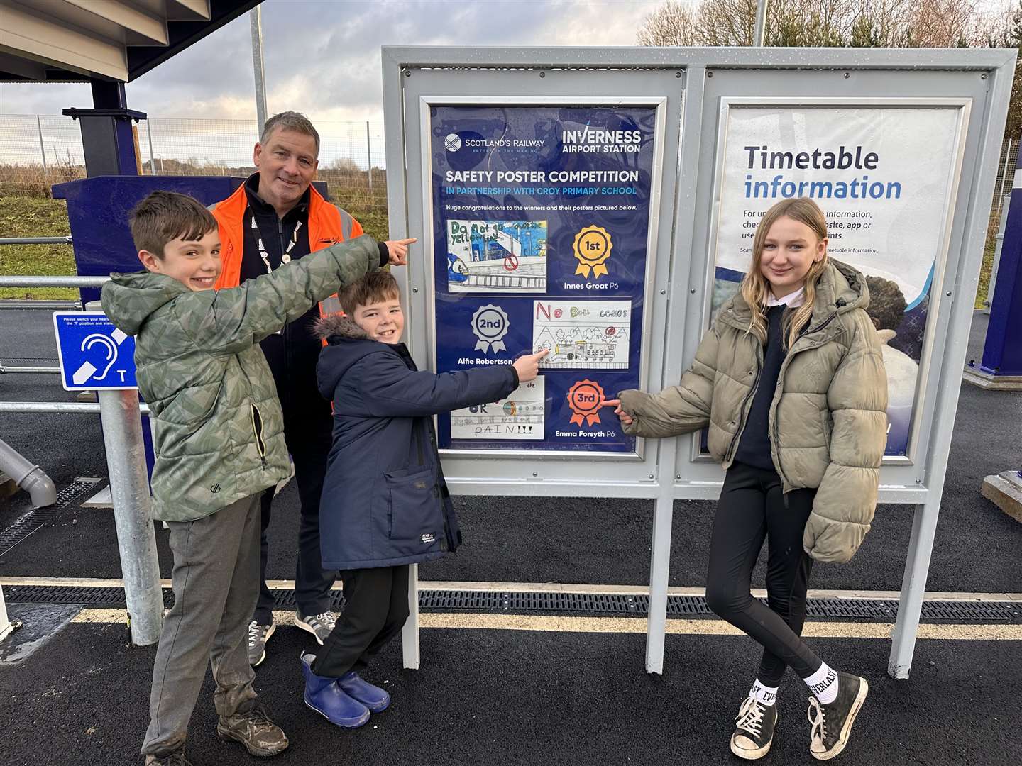 Cawdor Primary Pupils (from left) Innes Groat, Alfie Robertson & Emma Forsyth with Allan Brooking from Network Rail.