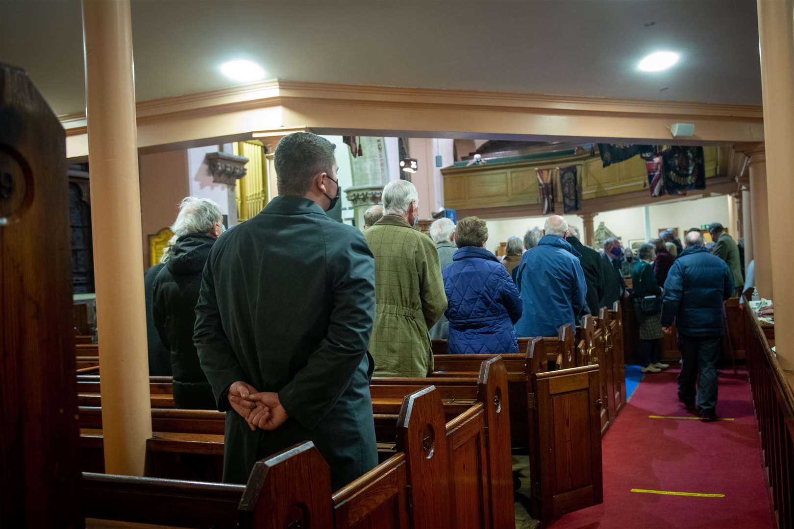 The congregation marks the end of worship at the Old High Church in Inverness.