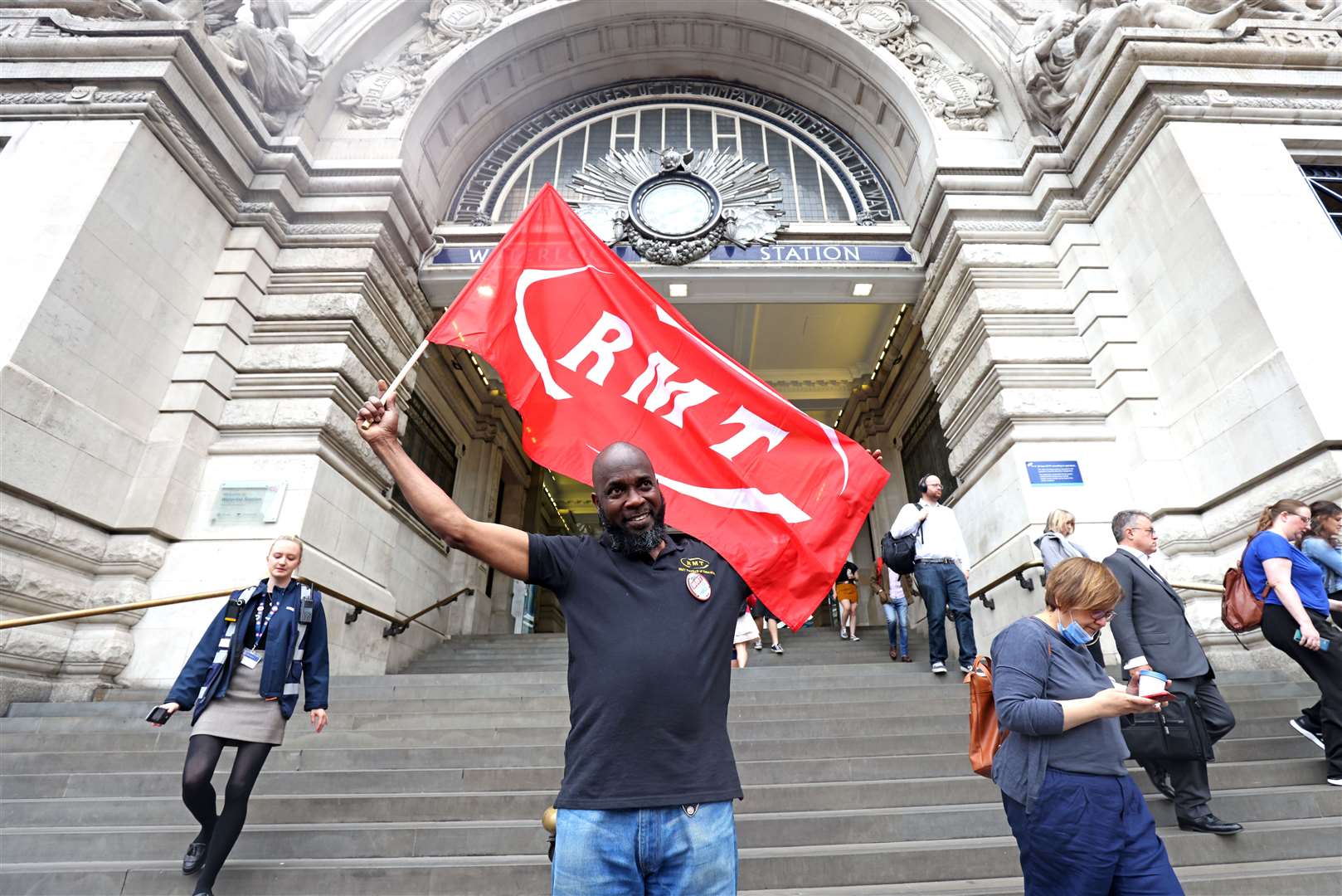 An RMT union member outside Waterloo station (James Manning/PA)