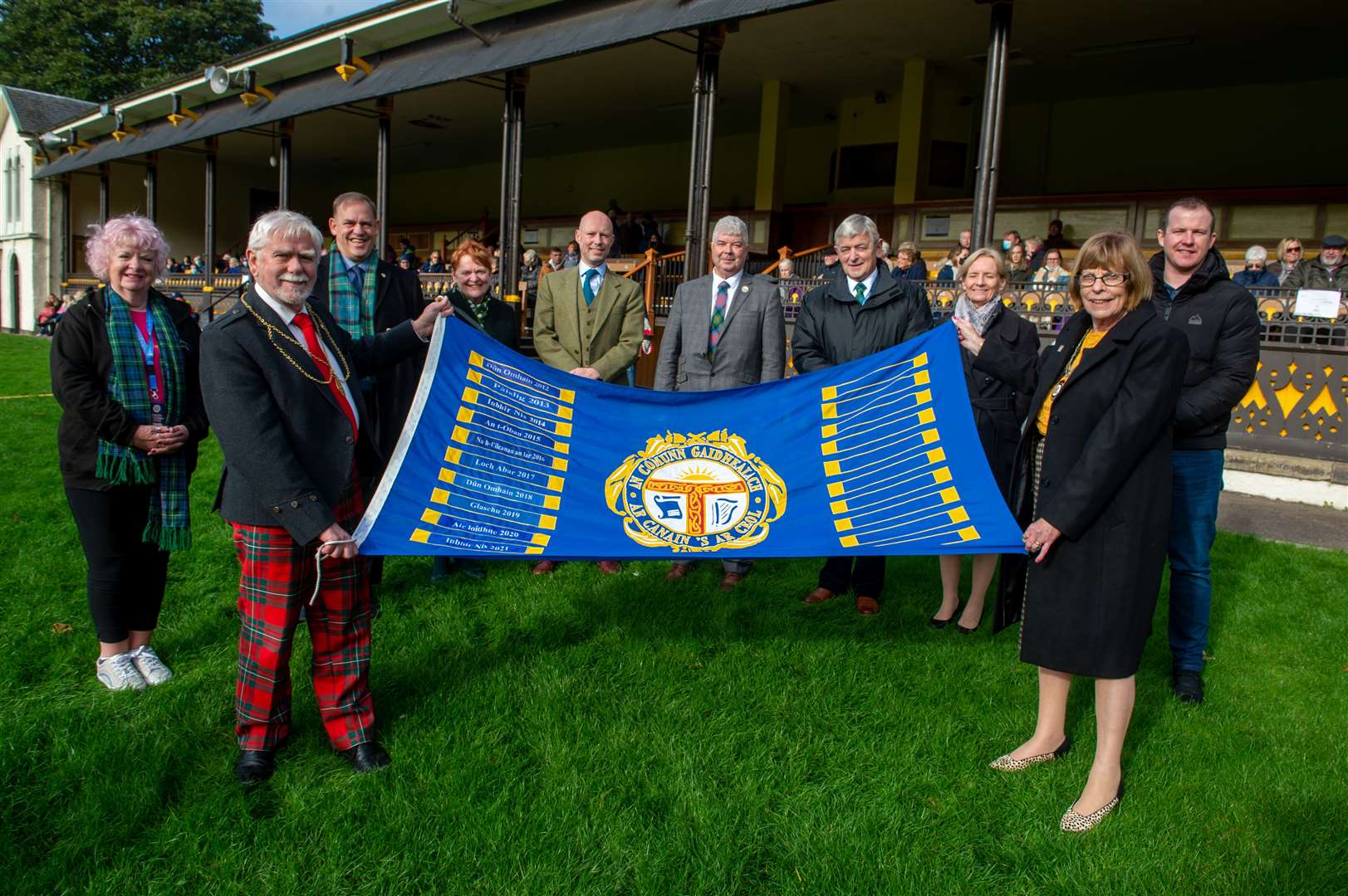 The Royal National Mòd Massed Choirs Event at The Northern Meeting Park. Depute Provost Councillor Bet McAllister, right, hands over the mod to Perth and Kinross Provost Dennis Melloy, left. Picture: Callum Mackay