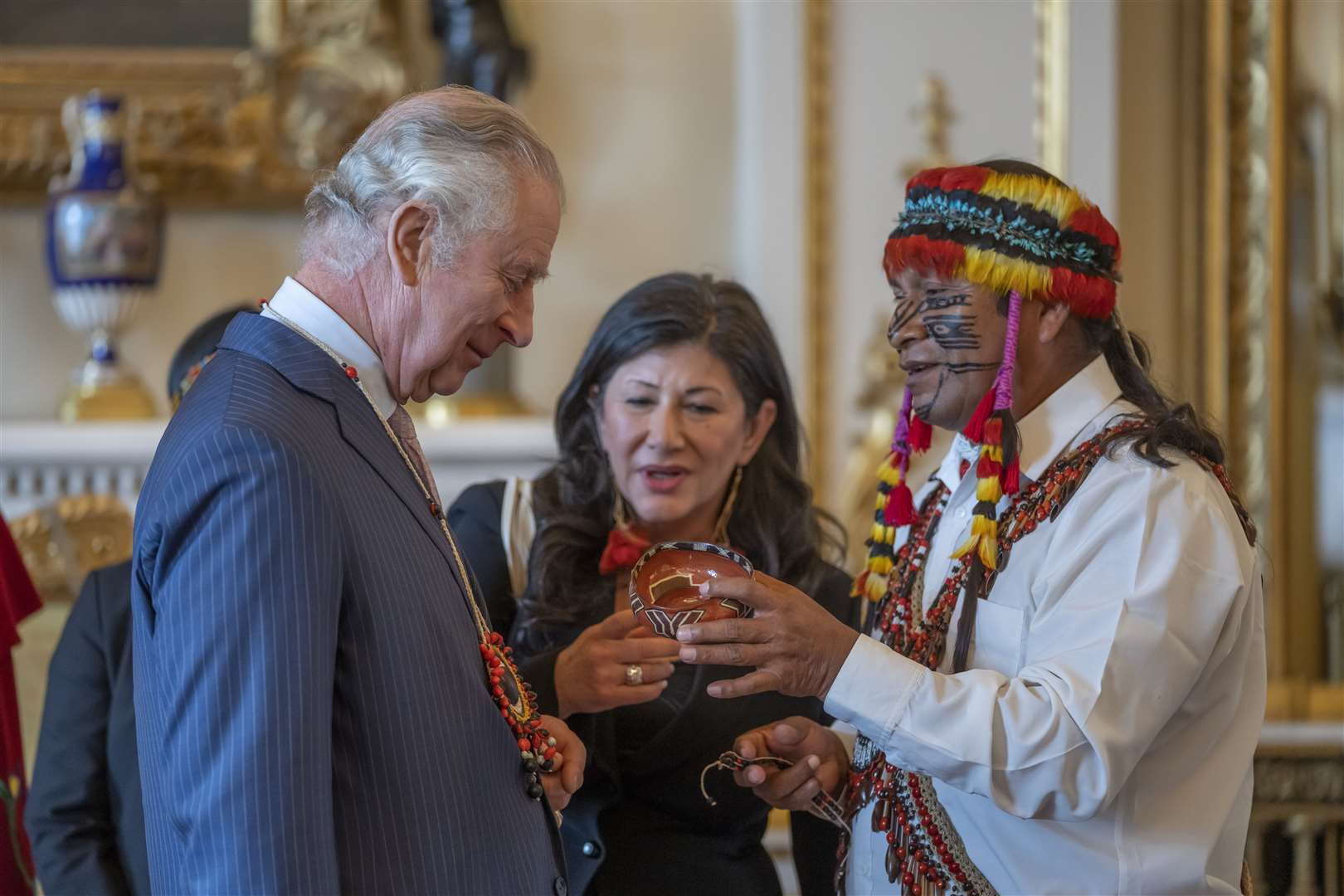 Uyunkar Domingo Peas presents gifts to Charles during a Palace reception in February (Kin Cheung/PA)