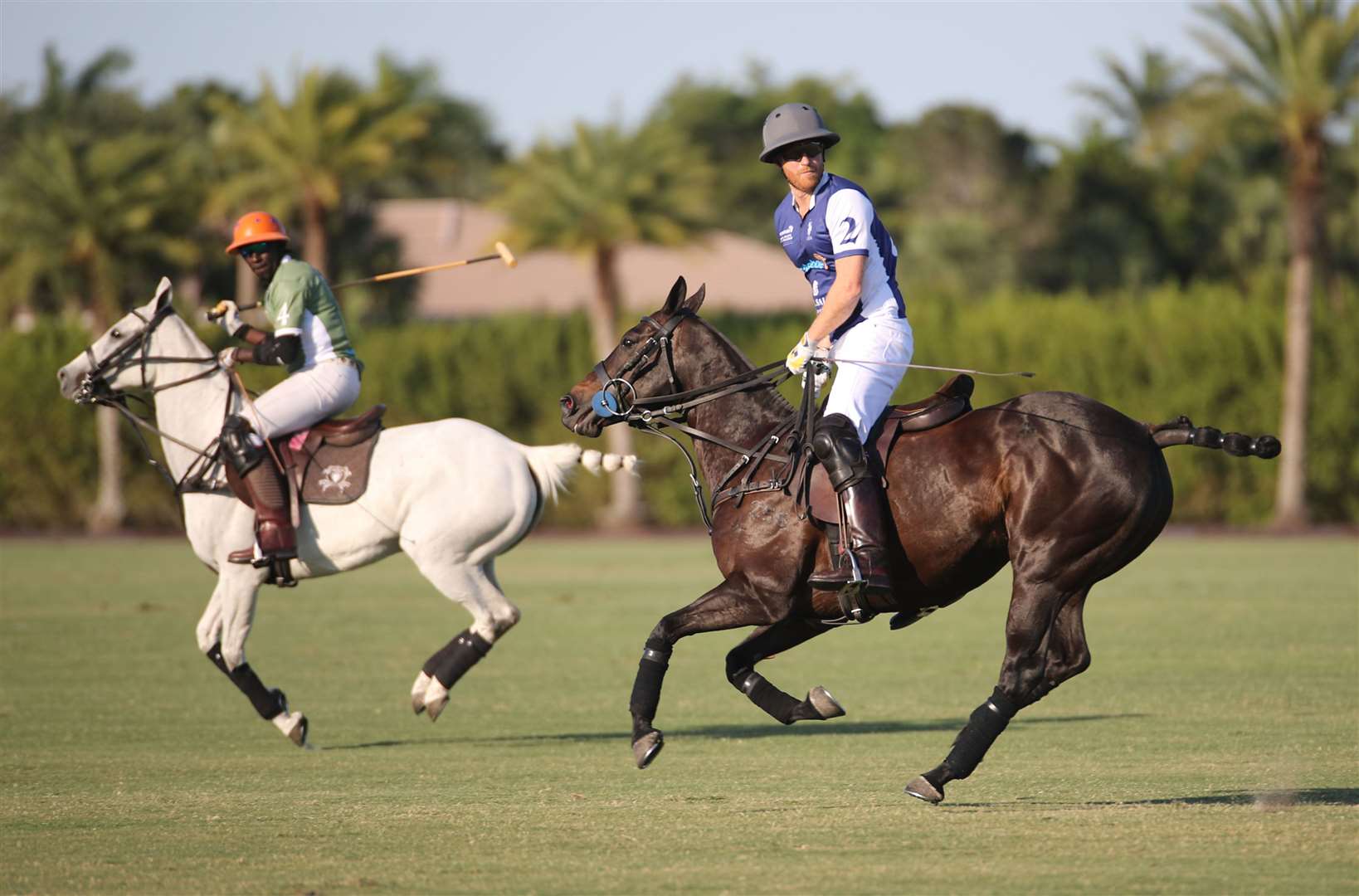 The duke (right) plays in a polo match during the Royal Salute Polo Challenge (Yaroslav Sabitov/PA)