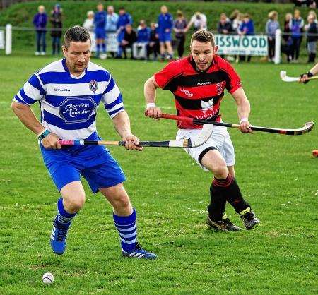 Glen MacKintosh scored a double for Newtonmore against Kinlochshiel in the Camanachd Cup.