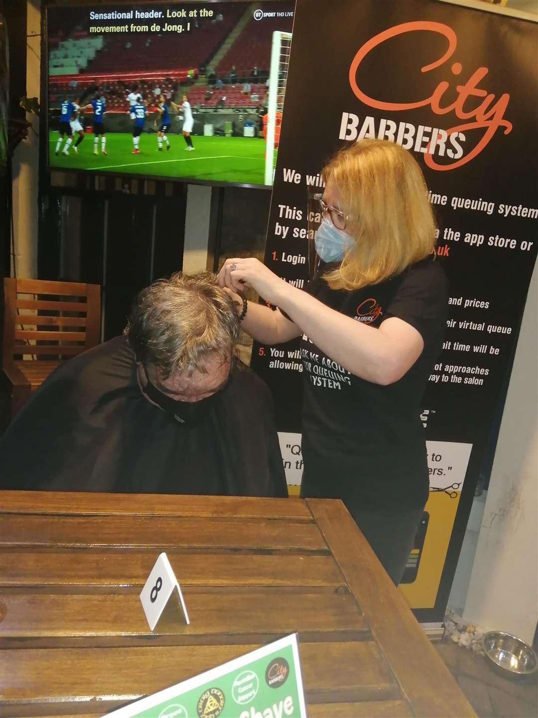 Erica Campbell of City Barbers, completing the shave