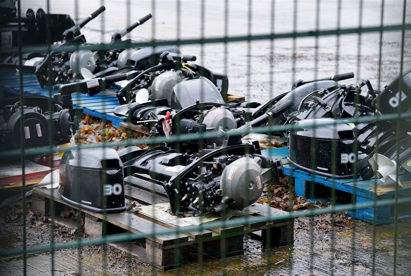 A view of small boat engines used to cross the Channel by people thought to be migrants at a warehouse facility in Dover, Kent (Gareth Fuller/PA)