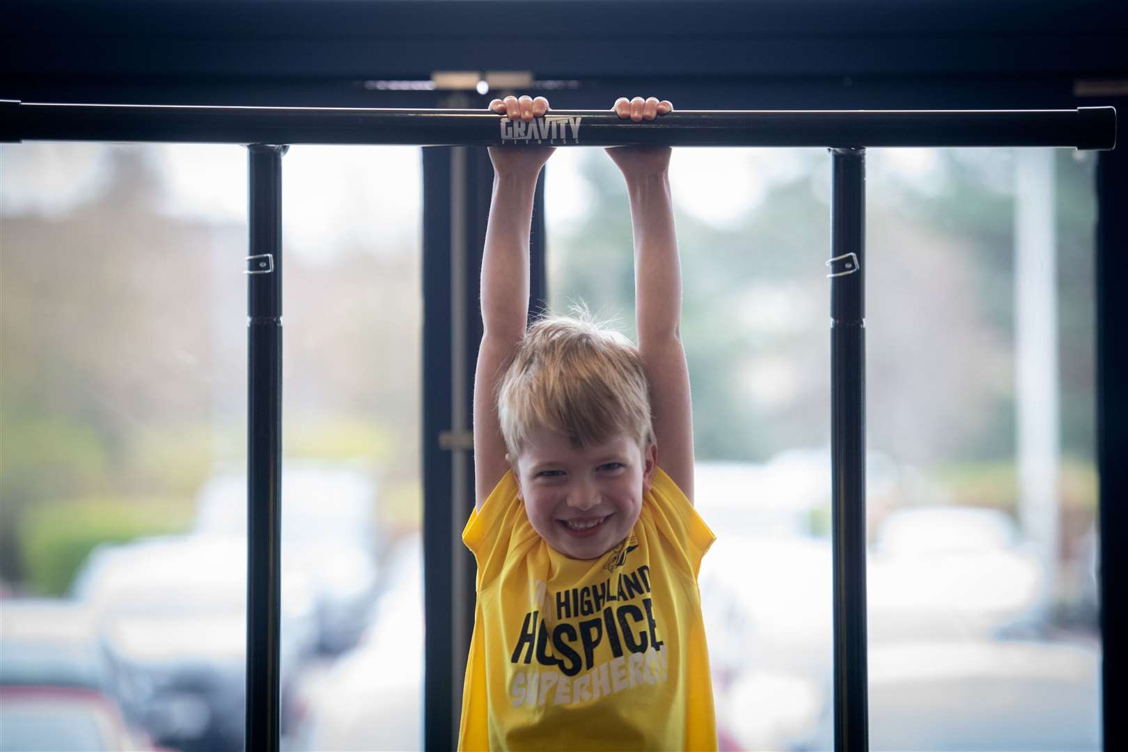 Young Bradley Brown sees how long he can last on the "hang tough" fitness test. Picture: Callum Mackay.