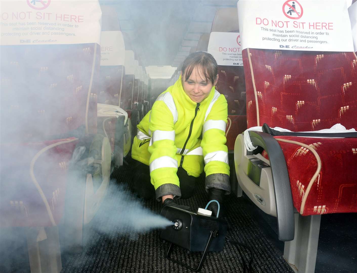 Violeta Grzyb demonstrates the anti-viral sanitising machine which will be deployed across the D&E Coaches fleet daily.