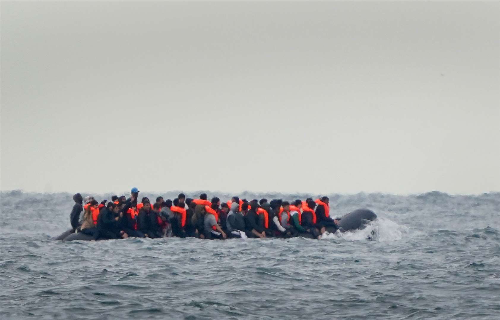 A group of people thought to be migrants crossing the Channel in a small boat heading for Kent (Gareth Fuller/PA)