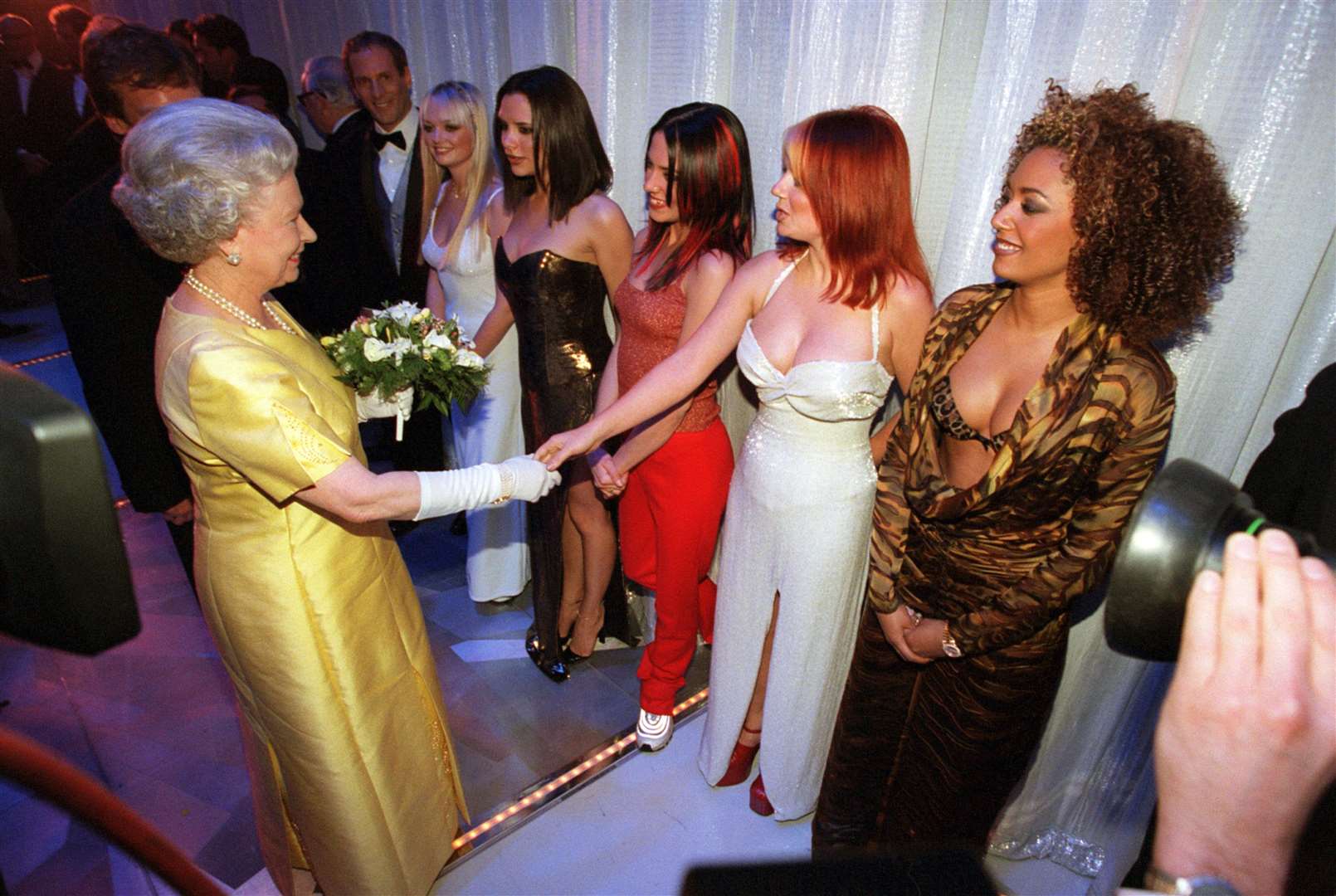 The Queen shakes hands with Geri Halliwell as she met the Spice Girls in 1998 (PA)