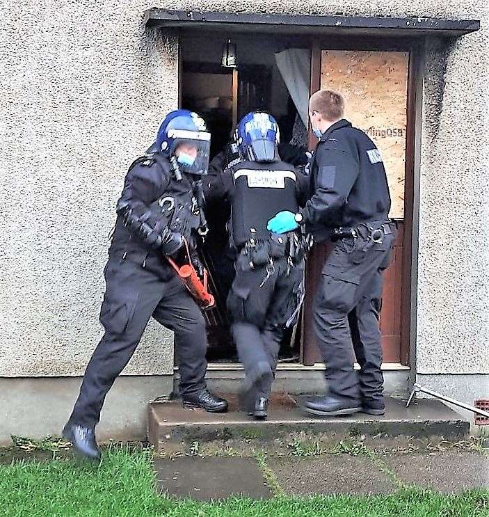 Police during a previous raid.