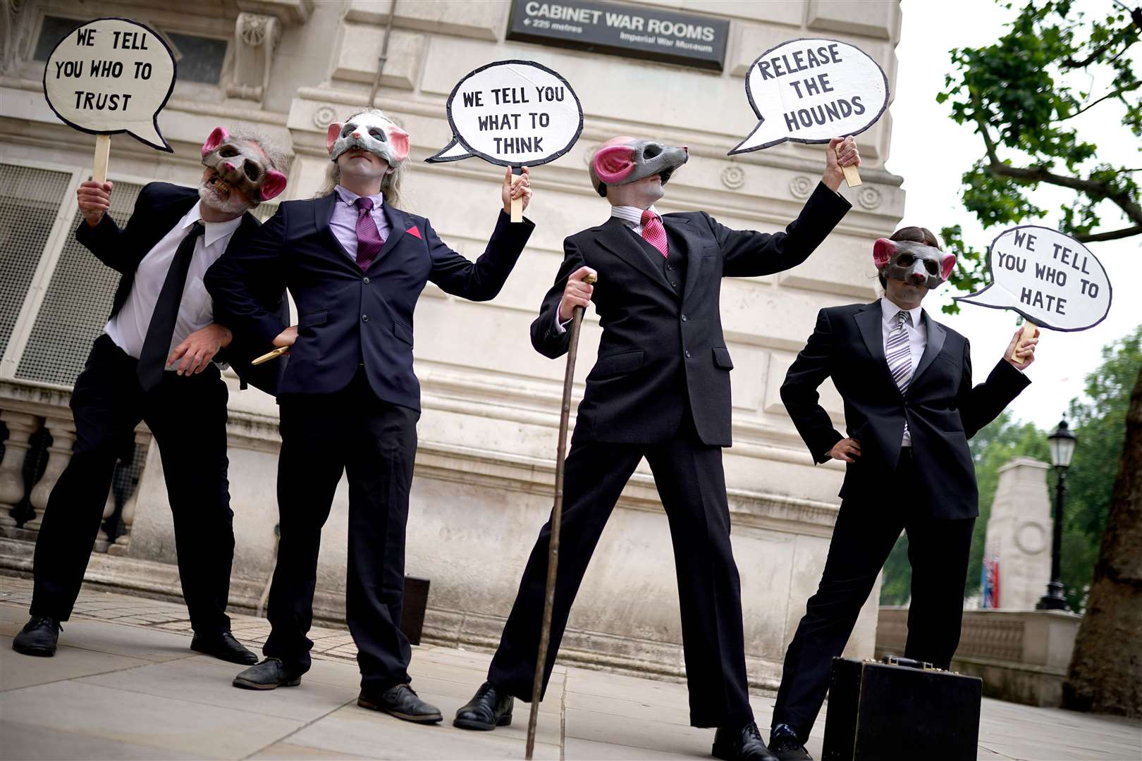 Extinction Rebellion demonstrators wear rat masks in Whitehall, London, in June 27 (PA)
