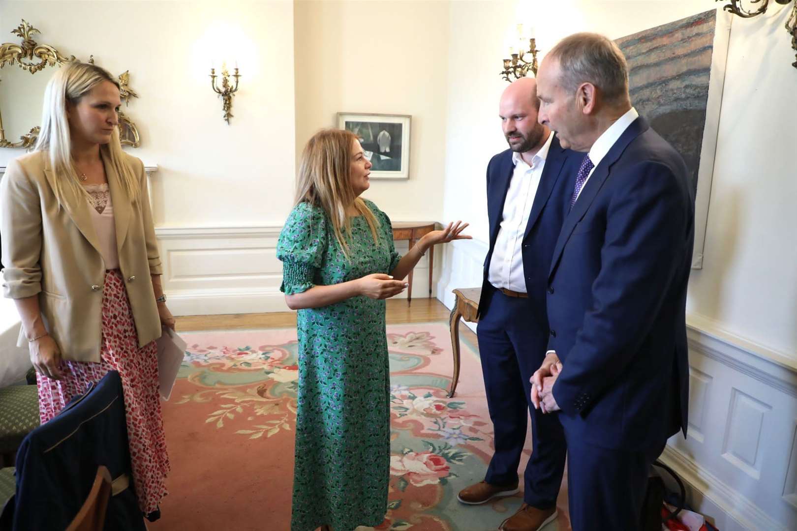Cat Gallagher-Wilkinson, centre, met with Tanaiste Micheal Martin, right, and justice minister Helen McEntee, left, at Iveagh House in Dublin (Department of Foreign Affairs/PA)