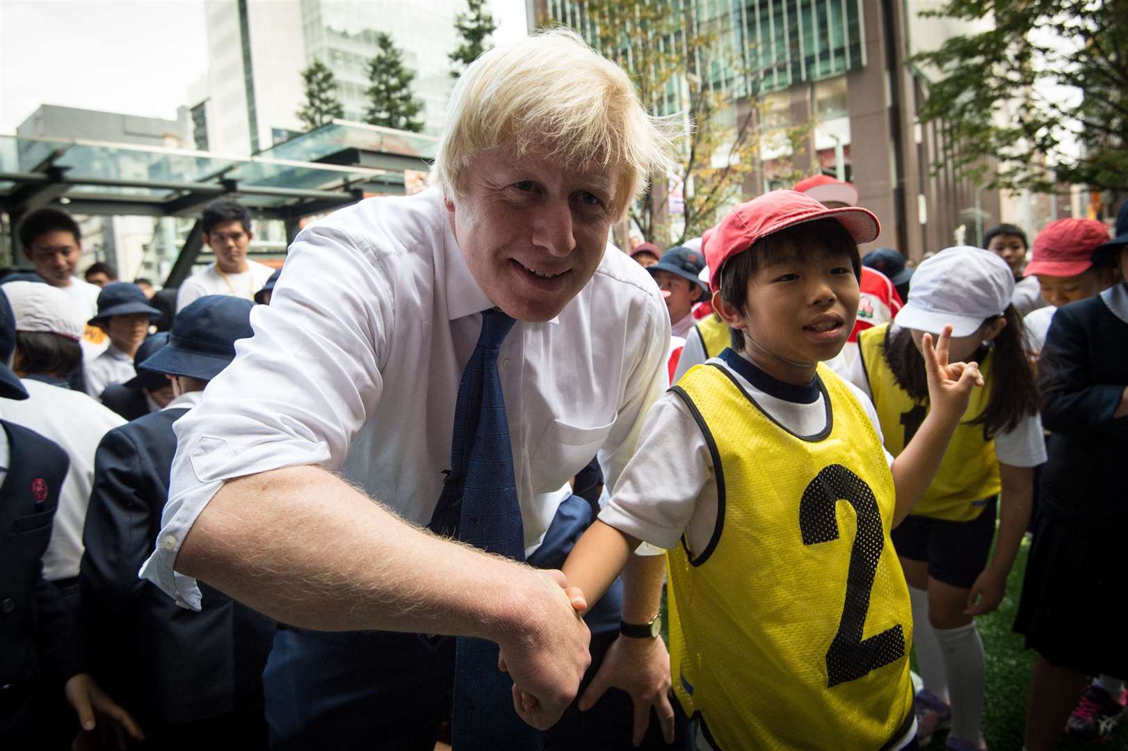 …Mr Johnson was later pictured shaking the hand of his fearless opponent 10-year-old Toki Sekiguchi (Stefan Rousseau/PA)