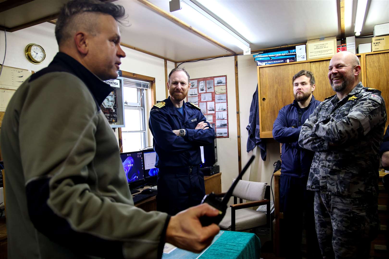 Base Commander Bogdan Gavrylyuk with HMS Protector’s ship’s Company at Vernadsky Antarctic research base (Royal Navy/PA)