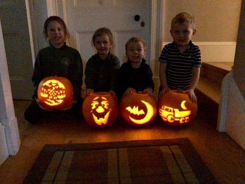 Emily Jane Ferguson and her little ones getting involved in some Halloween pumpkin carving fun