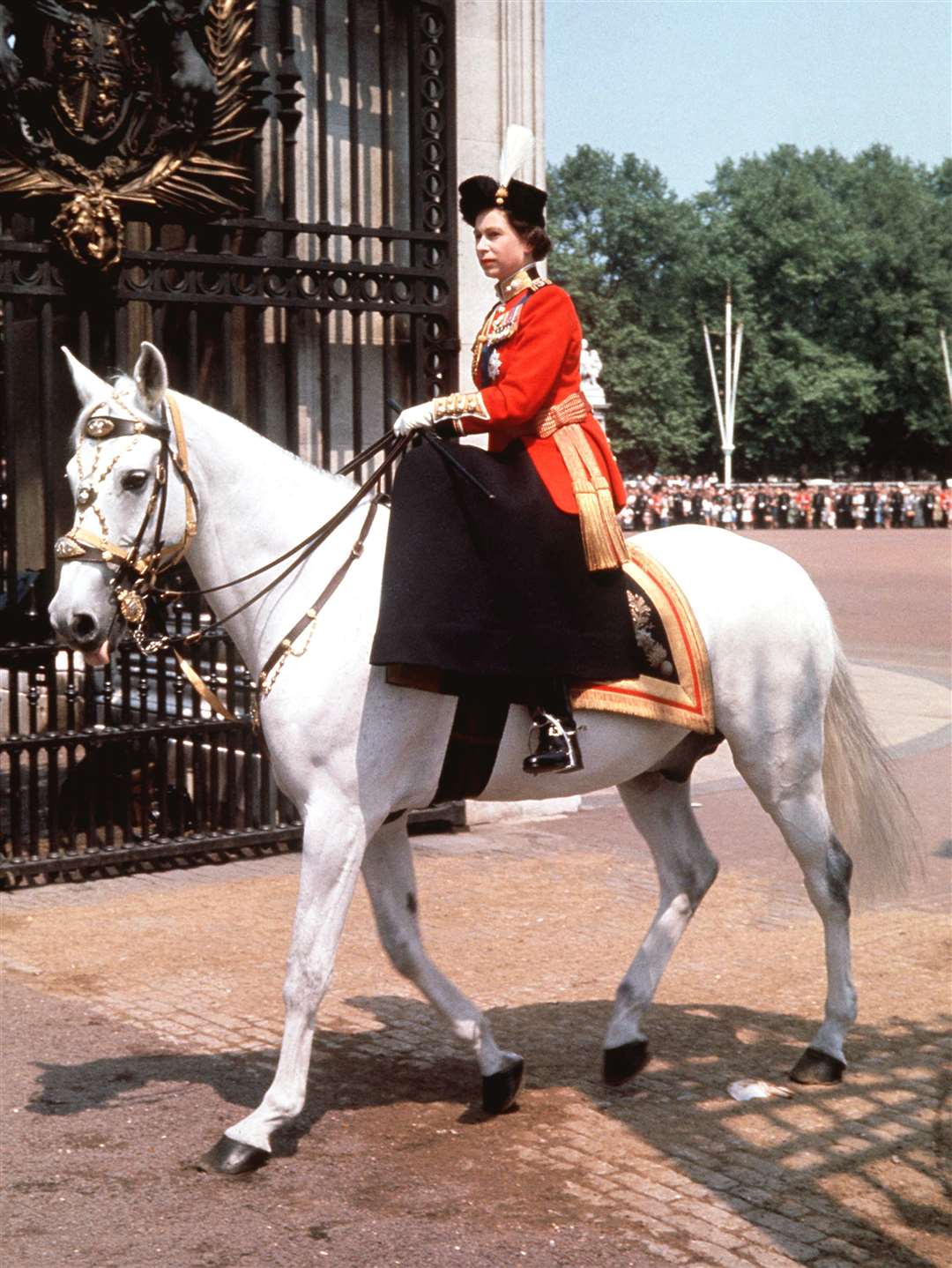 The Queen riding side-saddle after the Trooping the Colour ceremony in 1963 (PA)