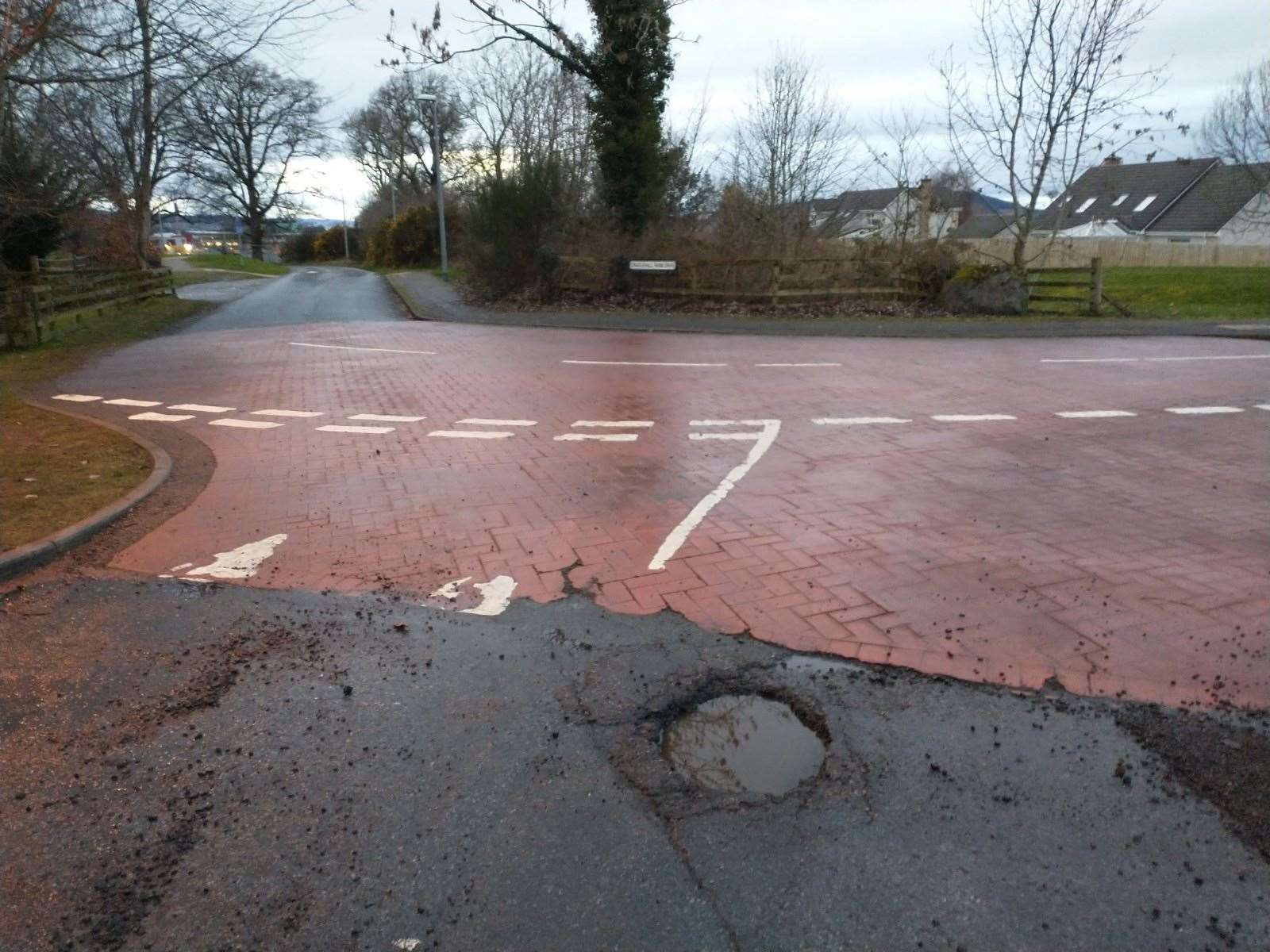 The pothole at the junction of Caulfield Road North and Cradlehall Farm Drive.