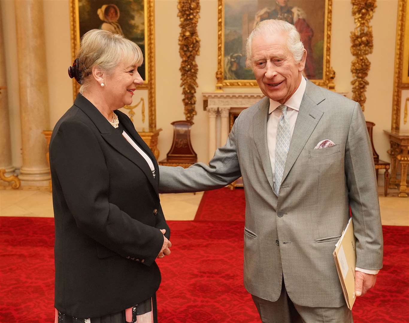 The King greets Dame Martina Milburn ahead of the Palace meeting (Jonathan Brady/PA)