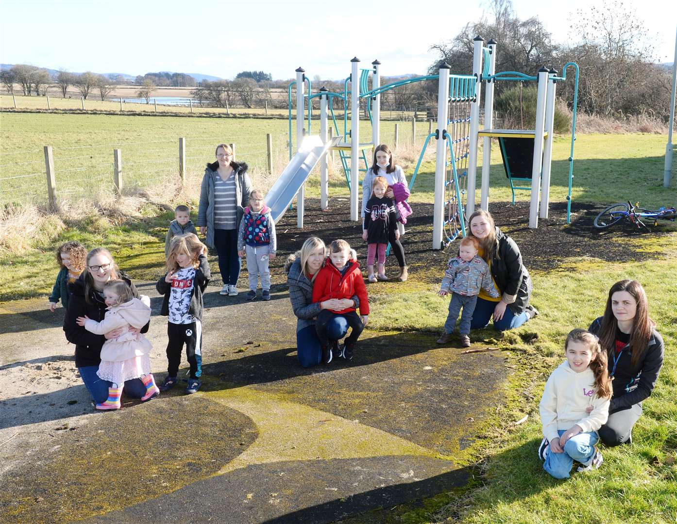 Children and parents at Orchard Park in Beauly where play equipment has been removed.