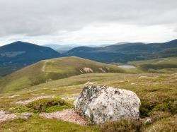 Walking towards Airgiod-meall, Money Hill, with Lochan Dubh a’ Chadha to the right.