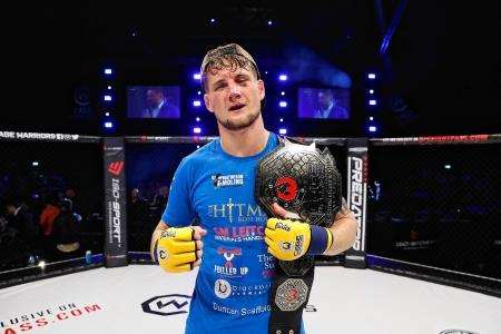Ross Houston with the Cage Warriors welterweight world title. Picture: Dolly Clew/Cage Warriors