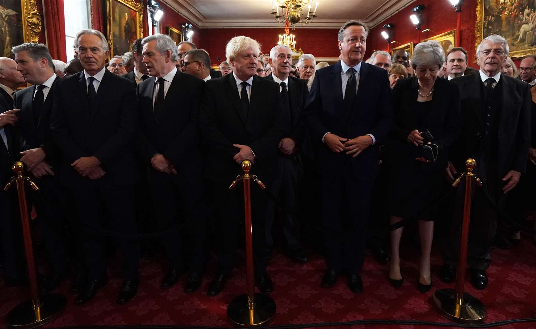 Privy counsellors, from left, Labour leader Sir Keir Starmer, former prime ministers Tony Blair, Gordon Brown, Boris Johnson, David Cameron, Theresa May and John Major stand ahead of the King’s arrival (Kirsty O’Connor/PA)