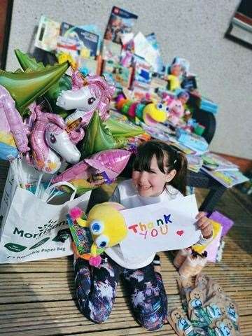 Emmie Marshall wih her donations to the children's ward.