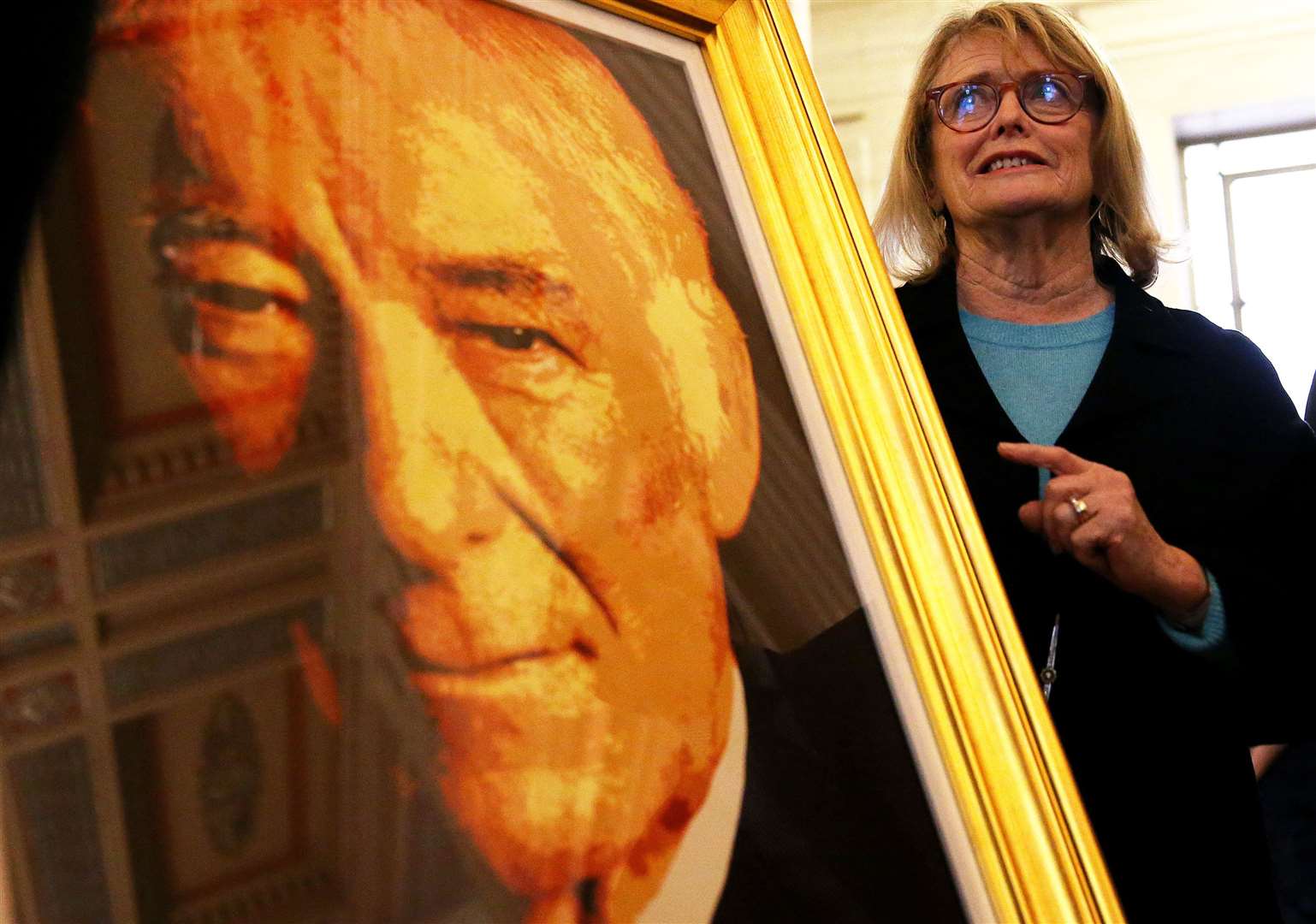 Marie Heaney with a portrait of her husband, poet Seamus Heaney (Brian Lawless/PA)