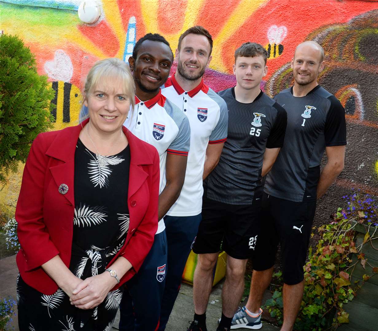 Mikeysline chief executive Emily Stokes with Ross County players Regan Charles-Cook and Keith Watson and Inverness Caledonian Thistle's Mark Ridgers and Harry Nicolson.